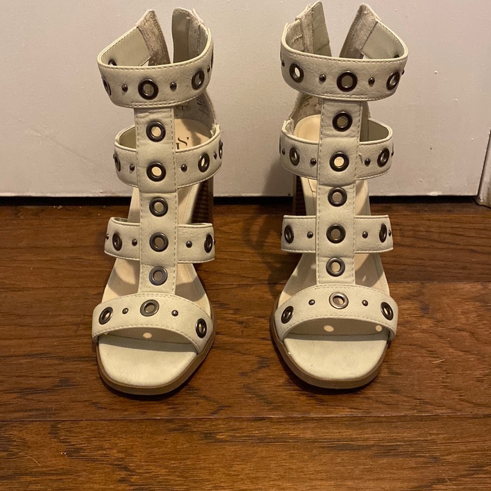 Beige open toed heels.